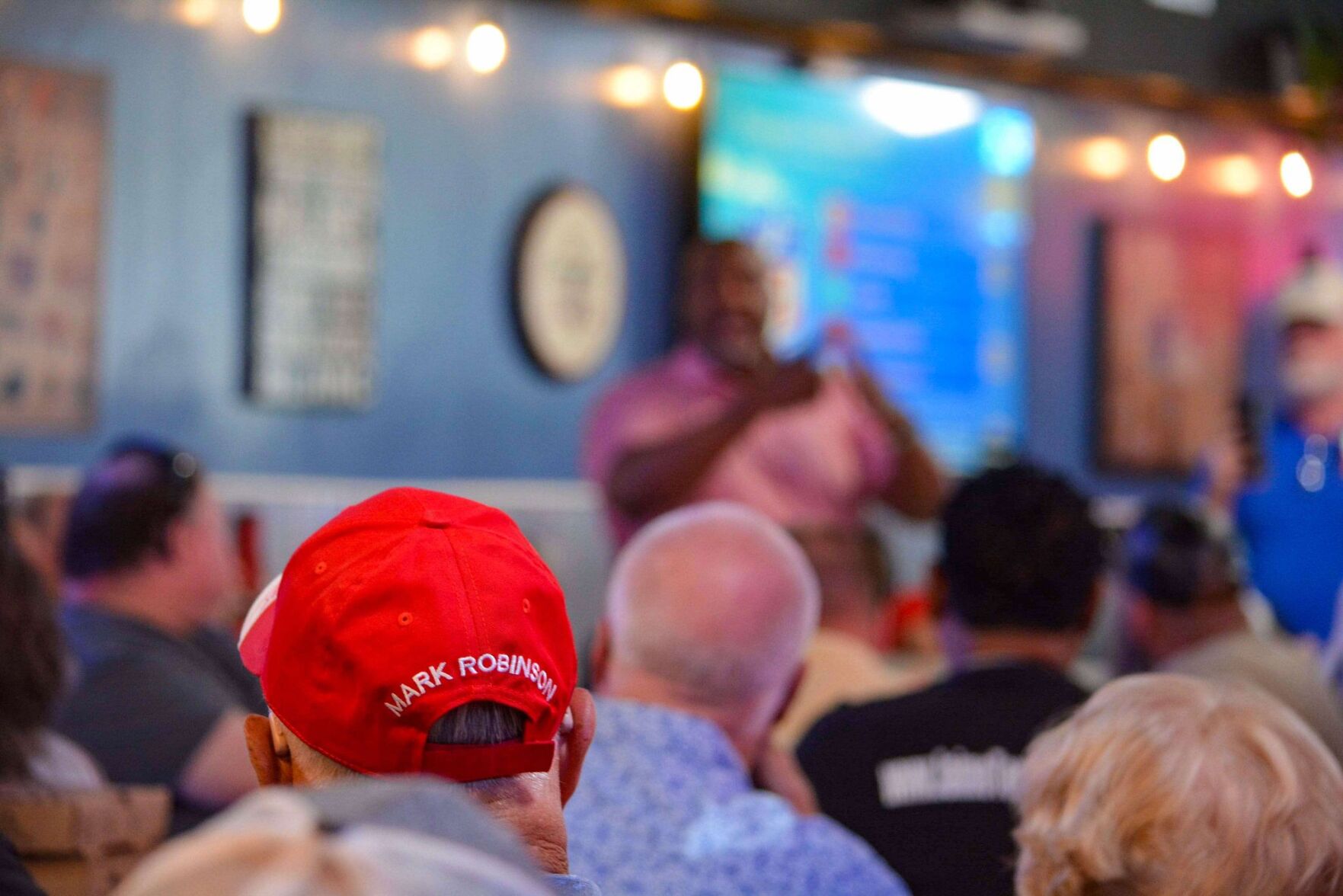Robinson supporter listens at Valdese campaign event